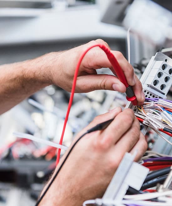 Voltmeter being used during electrical diagnostics